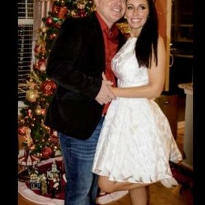 Gorgeous winter white cocktail dress with pockets!